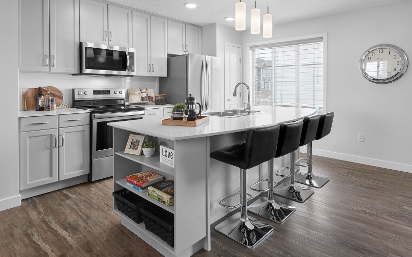 Grey kitchen with pendant lighting and an island in Michaelangelo in Edmonton, AB