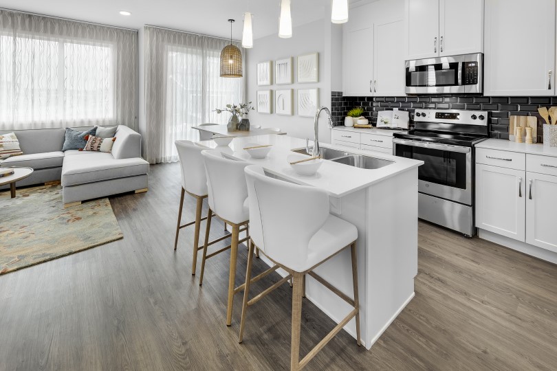 White kitchen with island in Finlay at Chappelle Gardens in Edmonton, AB
