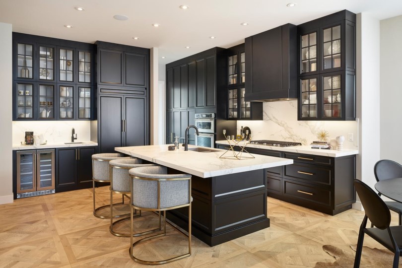 Dark kitchen in Sereno at Estate Homes at Cranstons Riverstone in Calgary, AB