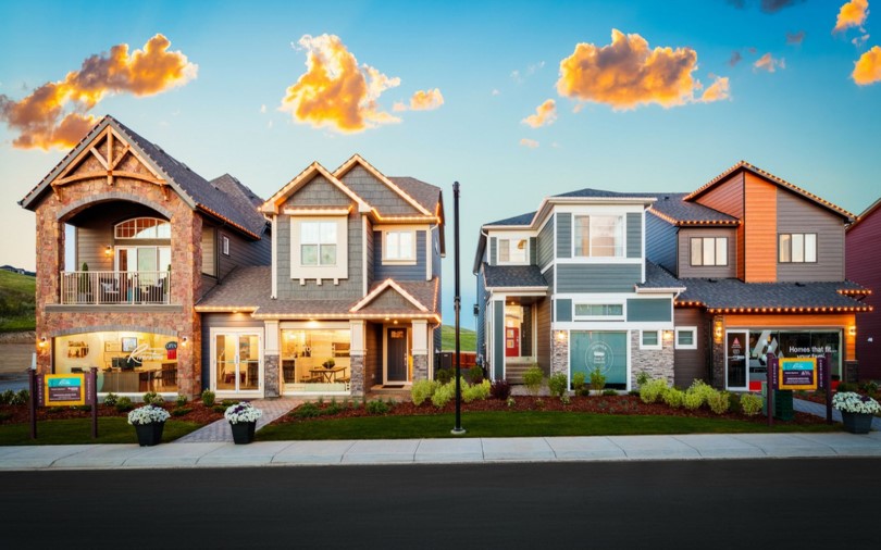 Exterior street scene of show homes at Cranstons Riverstone by Brookfield Residential in Calgary, AB