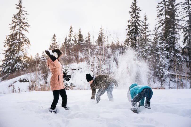 Family having a snow fight in Edmonton, AB