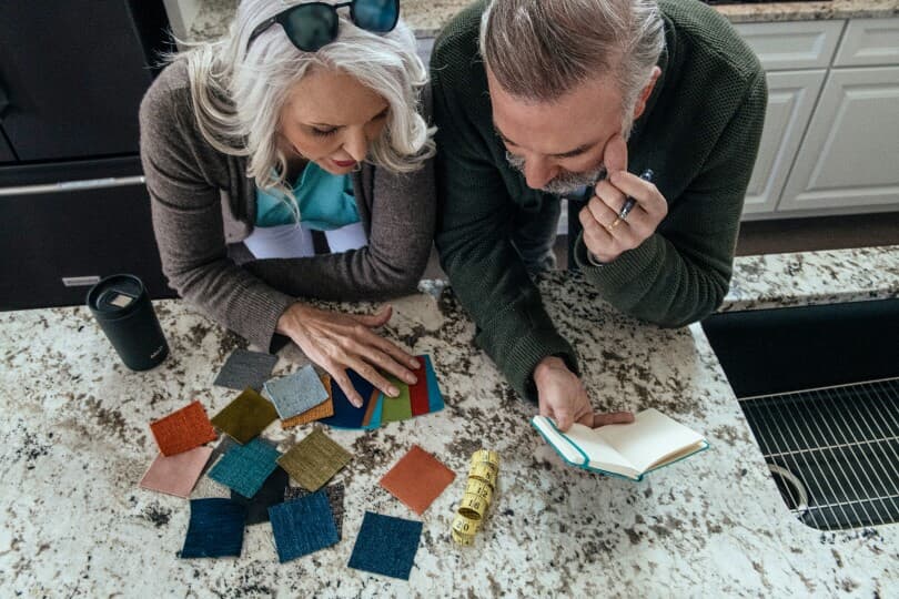 Couple reviewing color samples for their Brookfield Residential home