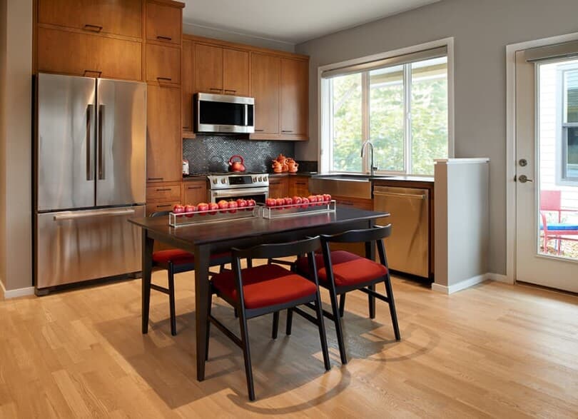 Wood tone kitchen in Tealight 2 at Central Park by Brookfield Residential in Denver, CO