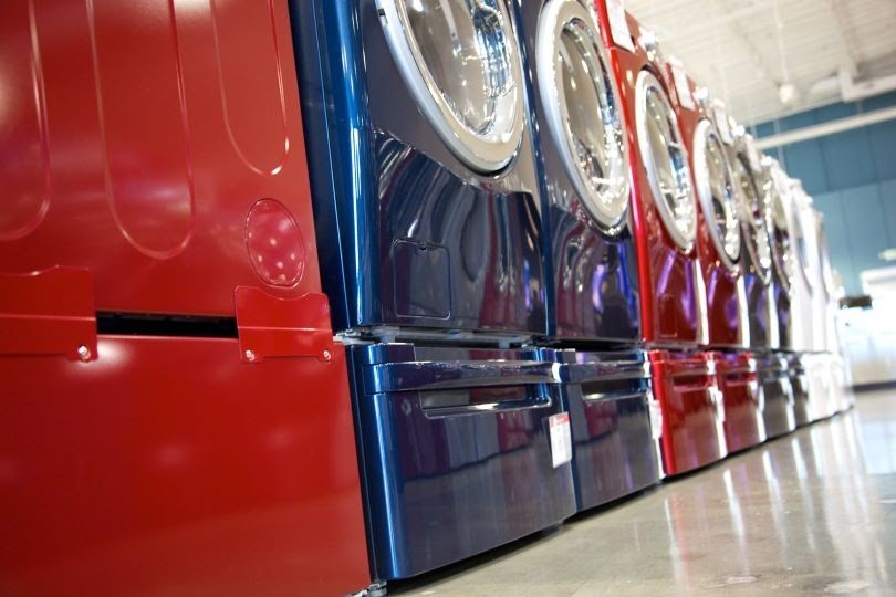 Large brightly colored clothes washers and dryers concept
