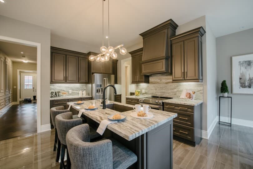 Wood tone kitchen with island in The Signature Collection at Woodhaven in Aurora ON 