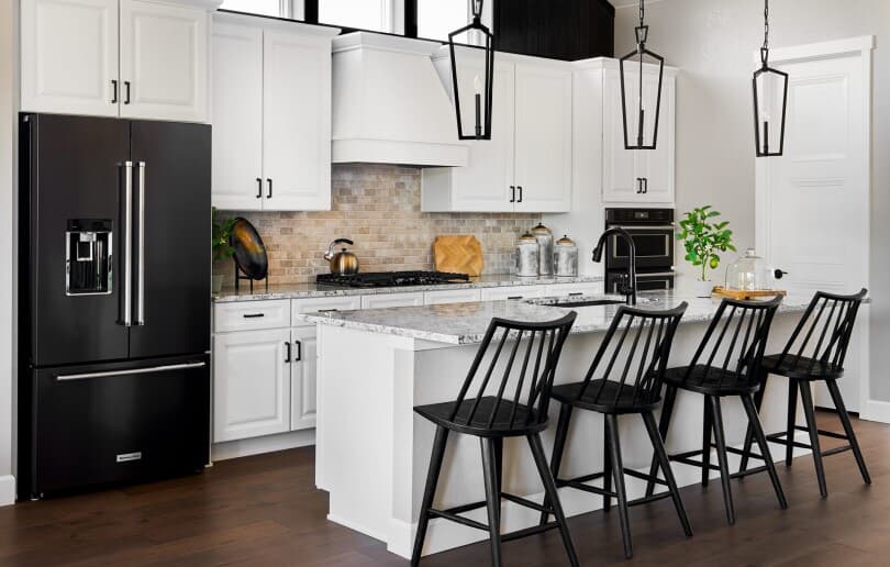 Stylish black and white kitchen at The Village of Castle Pines in Denver, CO