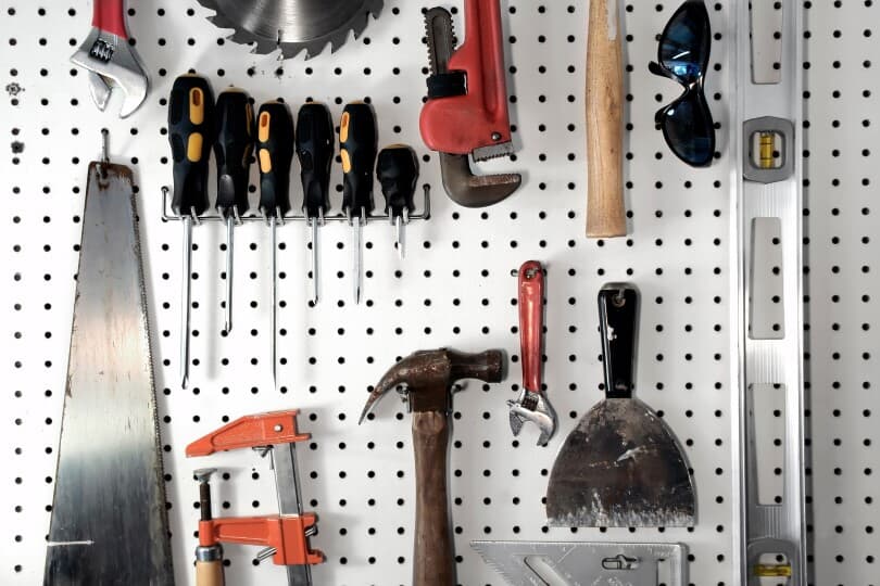 Variety of tools organized on a pegboard