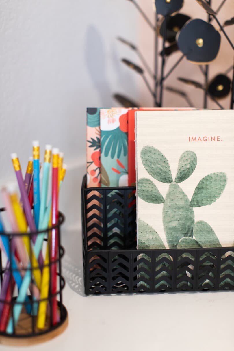 Pencils in a holder and journals organized on a desk in a Brookfield Residential home