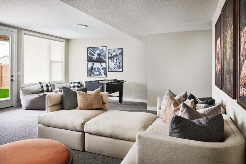 Basement game room in Robson 26 at Livingston by Brookfield Residential in Calgary, AB