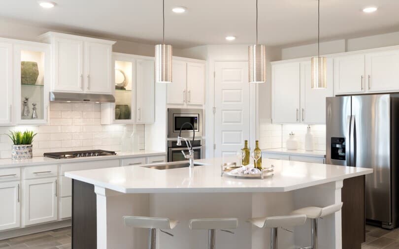 Bright white kitchen at Canyon Pass by Brookfield Residential in Lakeway, TX