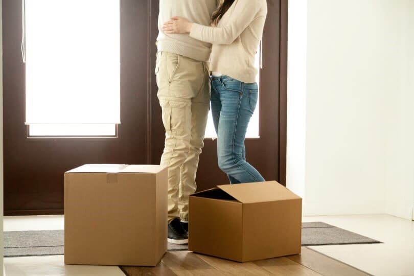 Concept of first-time homebuyers embracing inside home