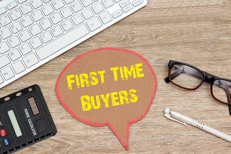 Concept of first-time homebuyers sign and calculator
