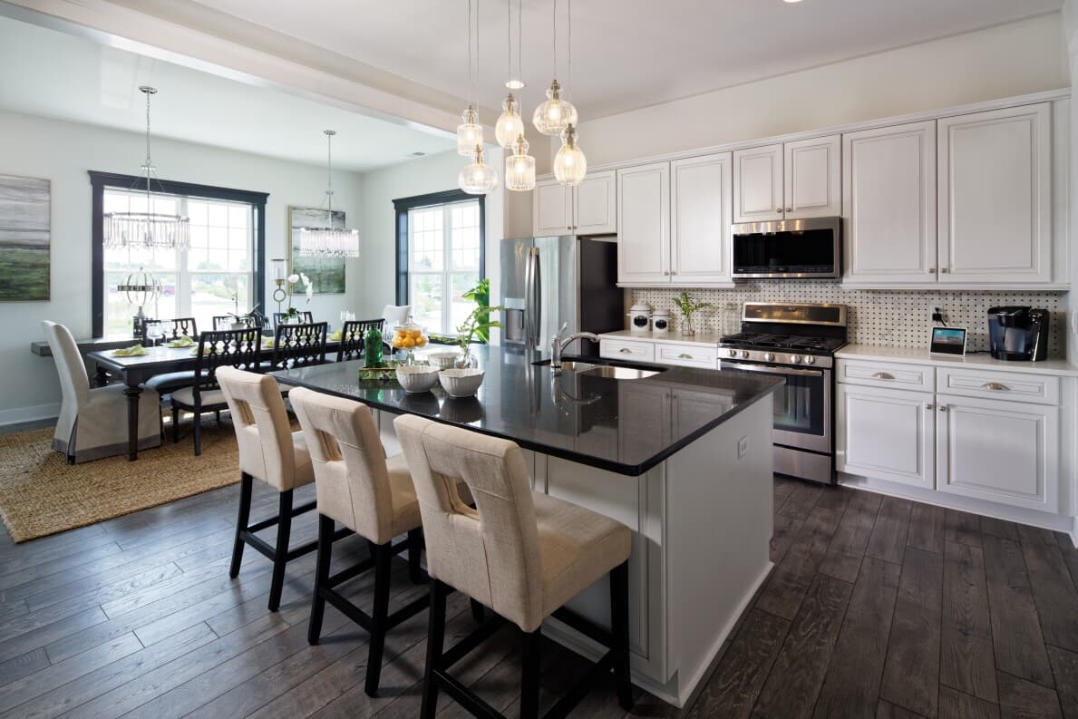 Kitchen and dining area in Savoy II at Heritage Shores by Brookfield Residential in Bridgeville, DE