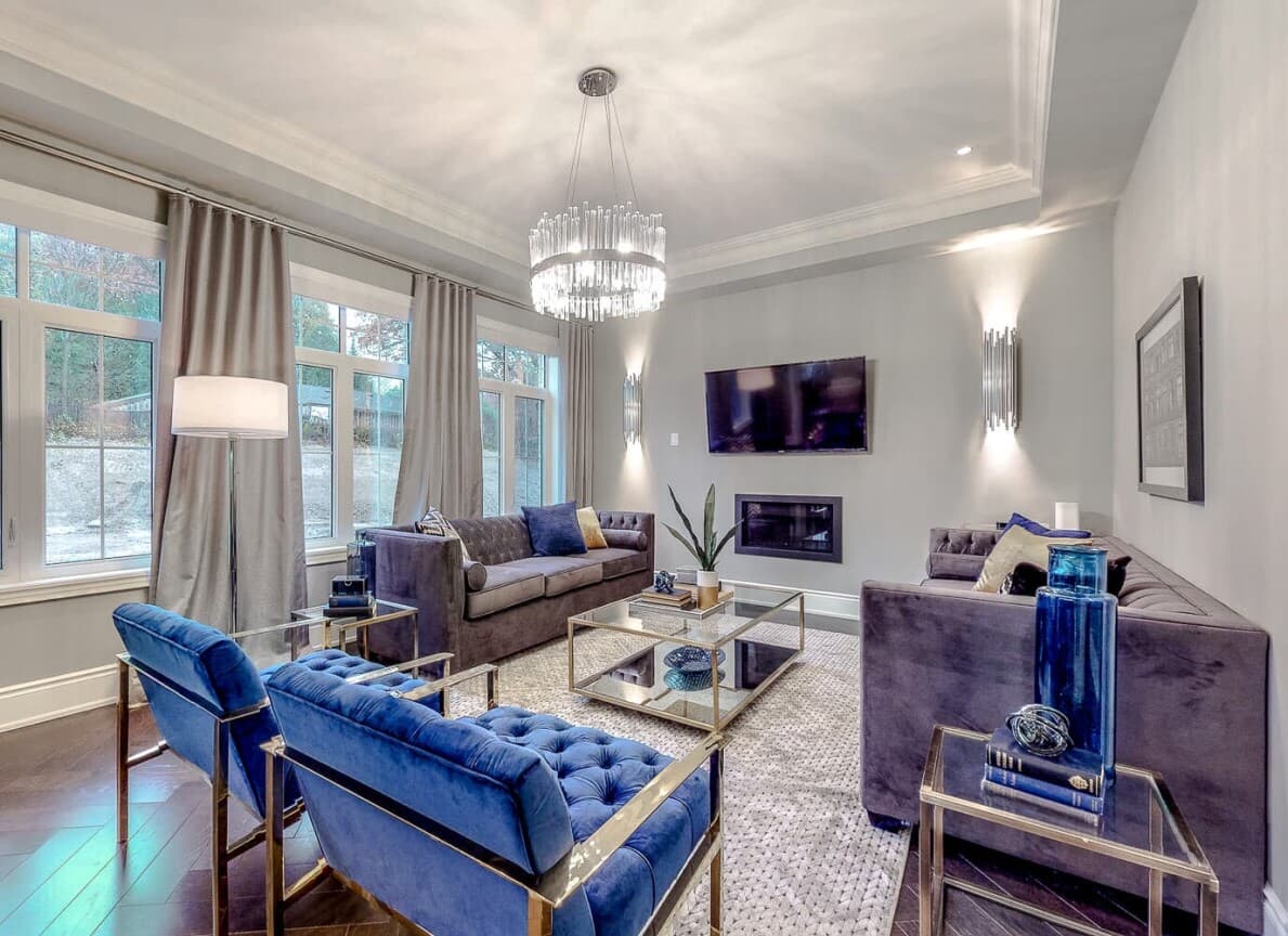 Family room with jewel tone furniture in Amethyst at Woodhaven in Aurora, ON