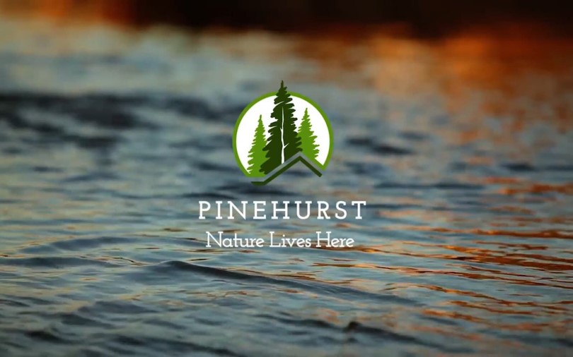 Pinehurst logo overlayed on water