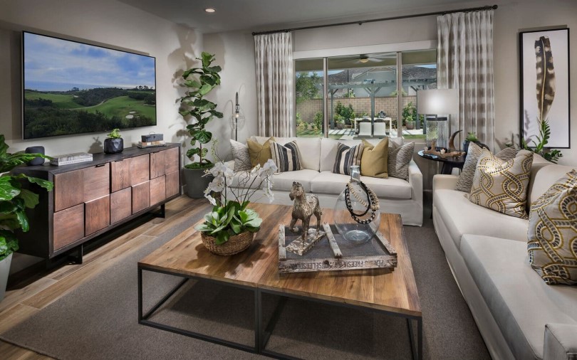 Couches and television in the great room of Residence 1 at Savannah in Menifee, CA