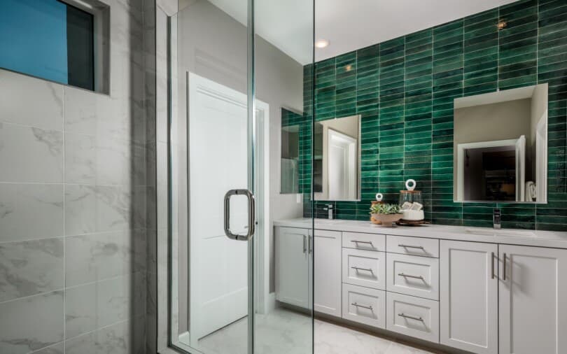 Primary bath with green tile in Luna at The Landing in Tustin, CA by Brookfield Residential