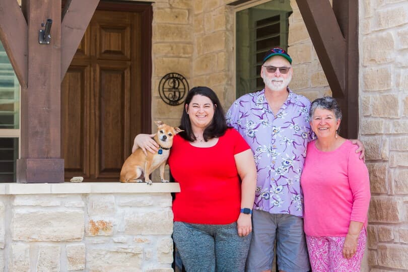 A resident family on their front porch inside the Retreat at Dripping Springs