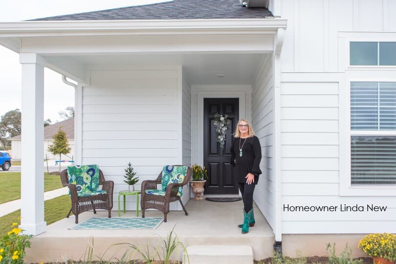 Homeowner Linda New on the porch of her home in Kissing Tree by Brookfield Residential in San Marcos, TX