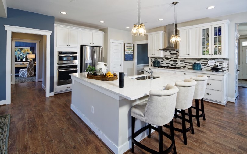 Bright white kitchen in the Brighton at the Bluffs at Sleeter Lake in Round Hill, VA