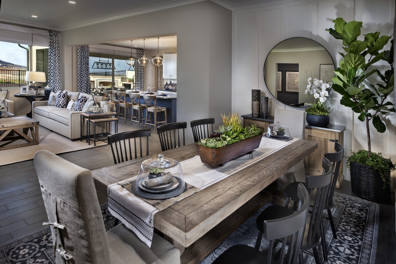 Dining room with rectangular grey wood table at Savannah in the community of Auide Murphy Ranch in Menifee, CA